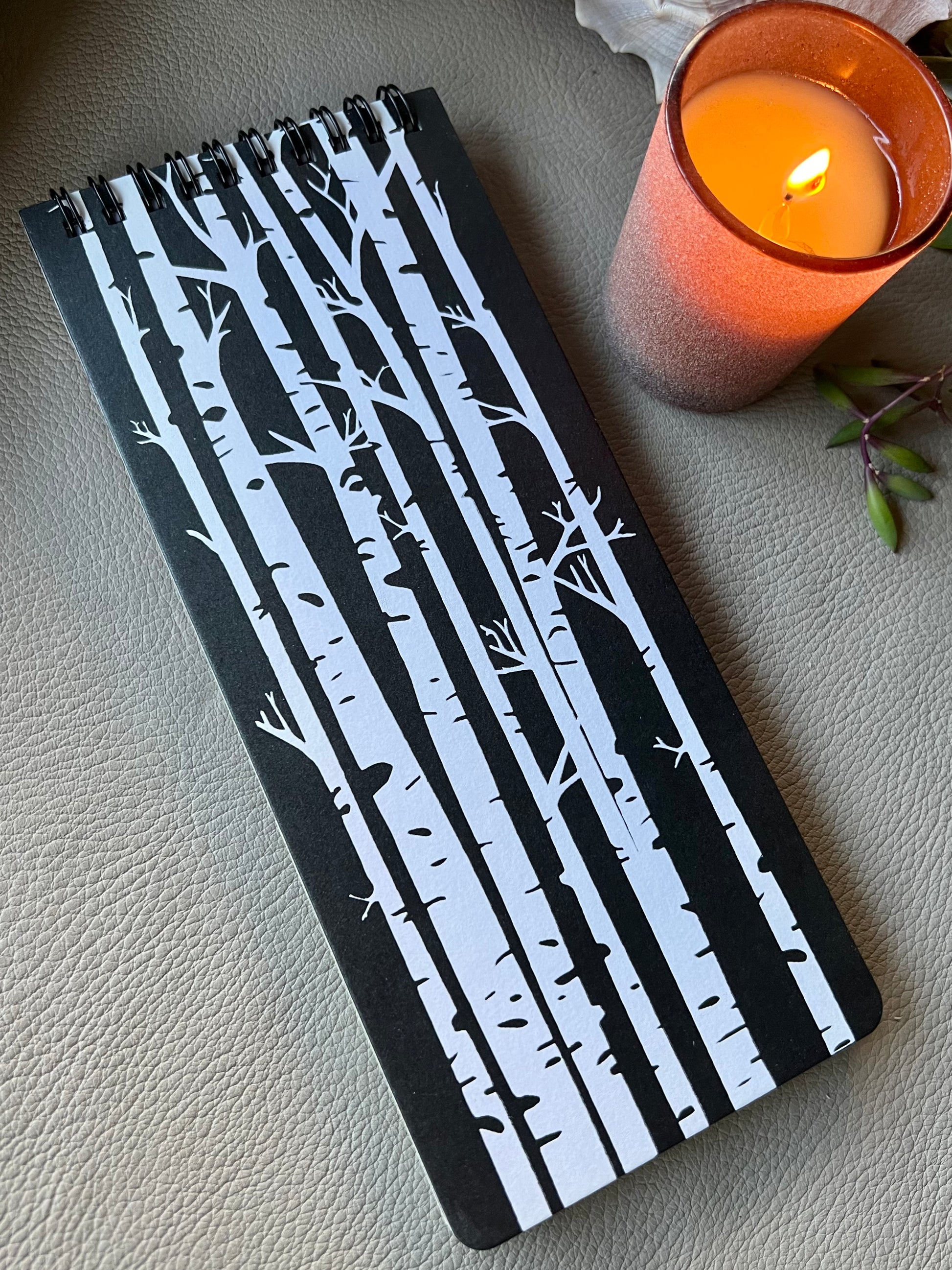 Black and white aspen trees printed on notebook